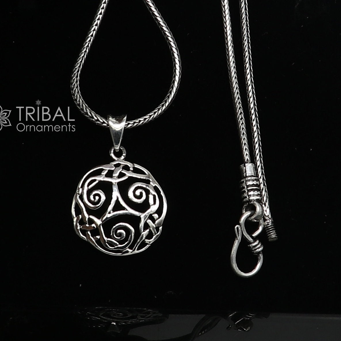 Sterling silver Triskelion Celtic pendant by Tribal Ornaments, featuring intricate tribal design on a stylish silver necklace.