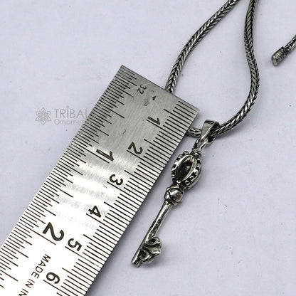 Sterling silver good luck key pendant with wheat chain necklace, tribal ornaments design, ideal for gifting jewelry.