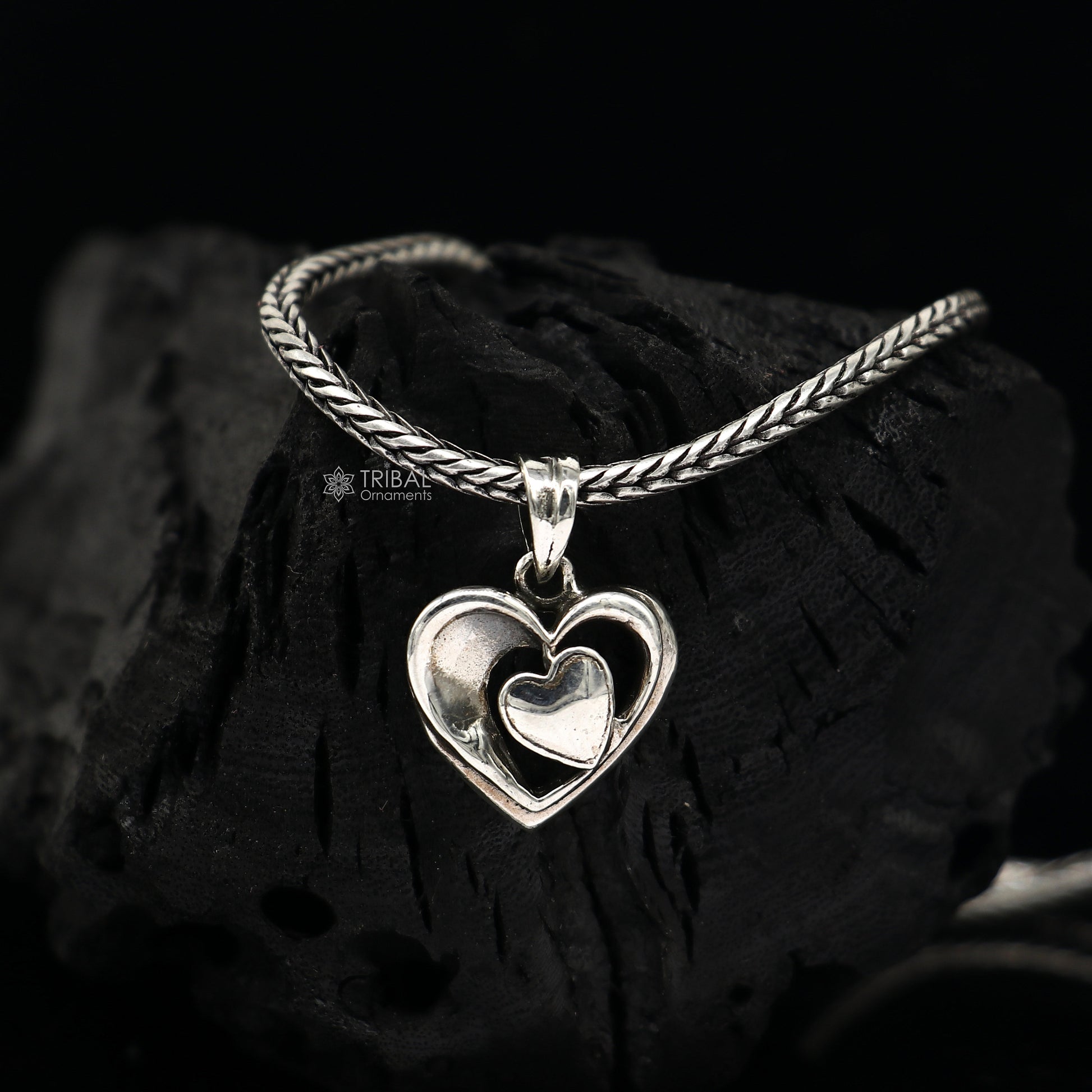 Sterling silver heart pendant necklace by TRIBAL ORNAMENTS, unisex jewelry with a unique design, perfect for gifting.