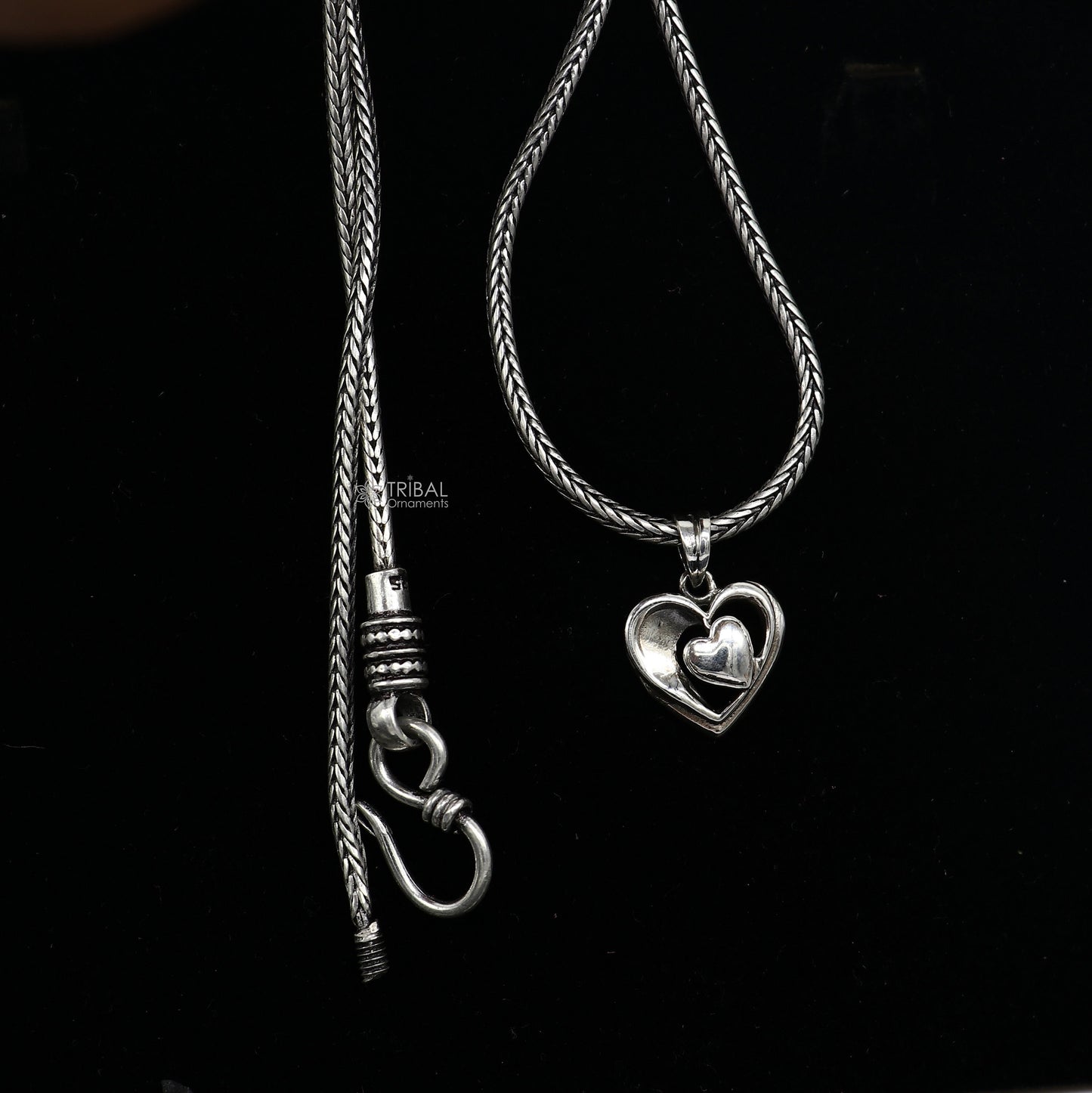 Sterling silver heart pendant necklace by Tribal Ornaments, unisex jewelry with unique design, perfect for gifting.
