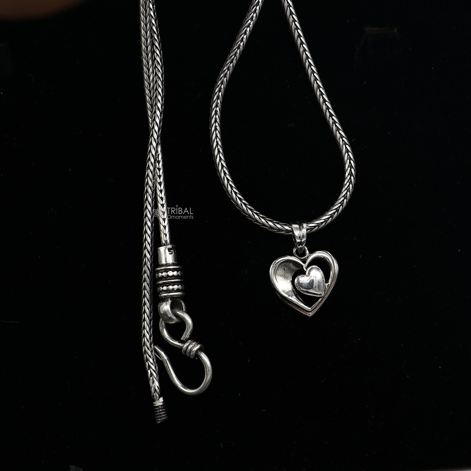 Sterling silver heart pendant necklace by Tribal Ornaments, unisex jewelry with unique design, perfect for gifting.