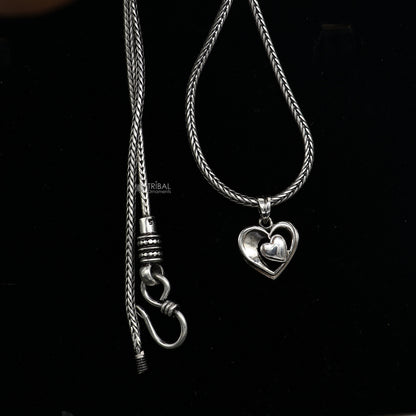 Sterling silver heart pendant necklace by Tribal Ornaments, unisex jewelry with unique design, perfect for gifting.