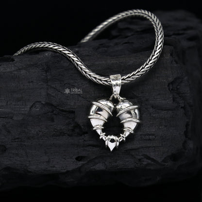 Sterling silver heart-shaped pendant necklace by Tribal Ornaments, featuring a unique design, perfect for gifting jewelry.