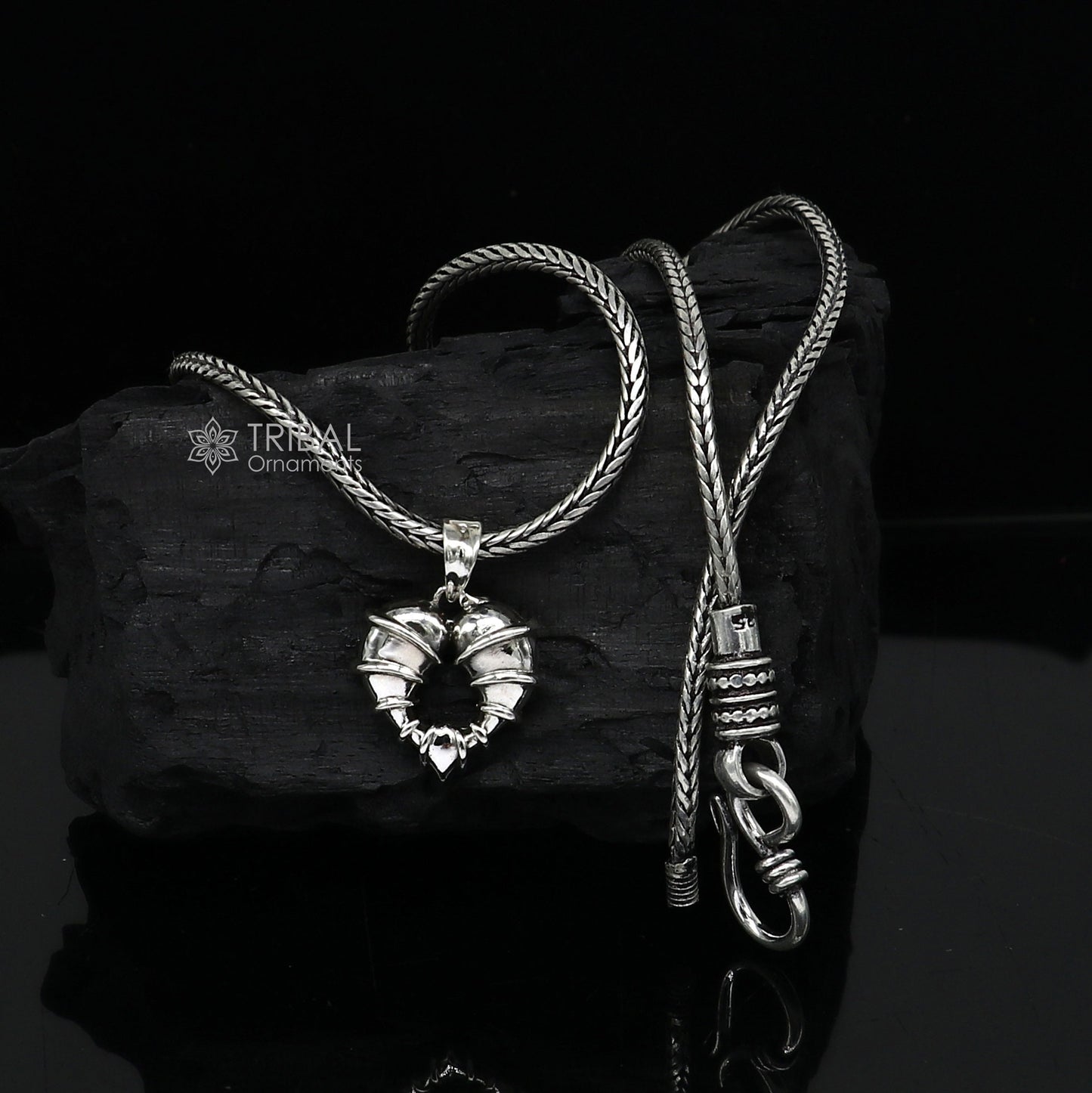 Sterling silver heart-shaped pendant necklace by Tribal Ornaments, showcasing a unique design perfect for gifting jewelry.