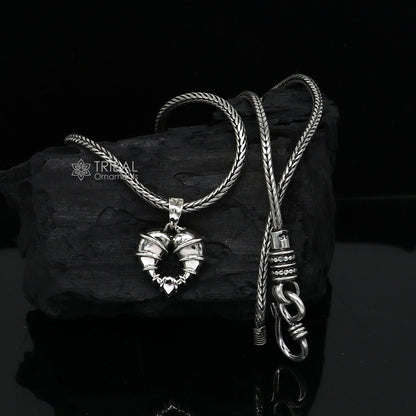 Sterling silver heart-shaped pendant necklace by Tribal Ornaments, showcasing a unique design perfect for gifting jewelry.