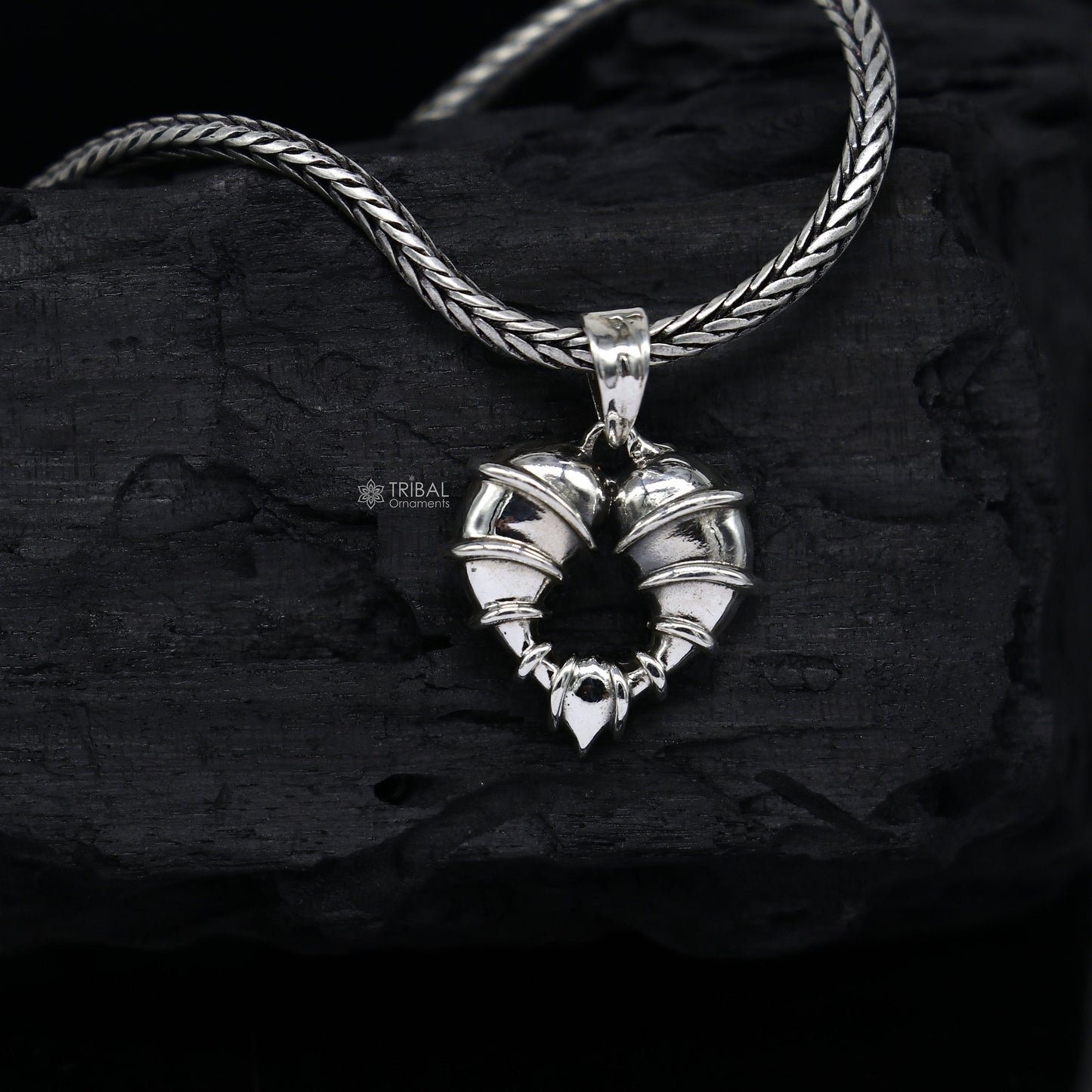 Sterling silver heart-shaped pendant jewelry by TRIBAL ORNAMENTS, featuring a unique design, ideal for gifting or everyday wear.