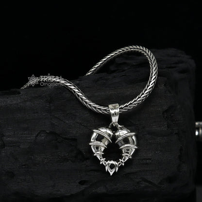 Sterling silver heart-shaped pendant necklace by Tribal Ornaments, featuring a unique design perfect for gifting jewelry.
