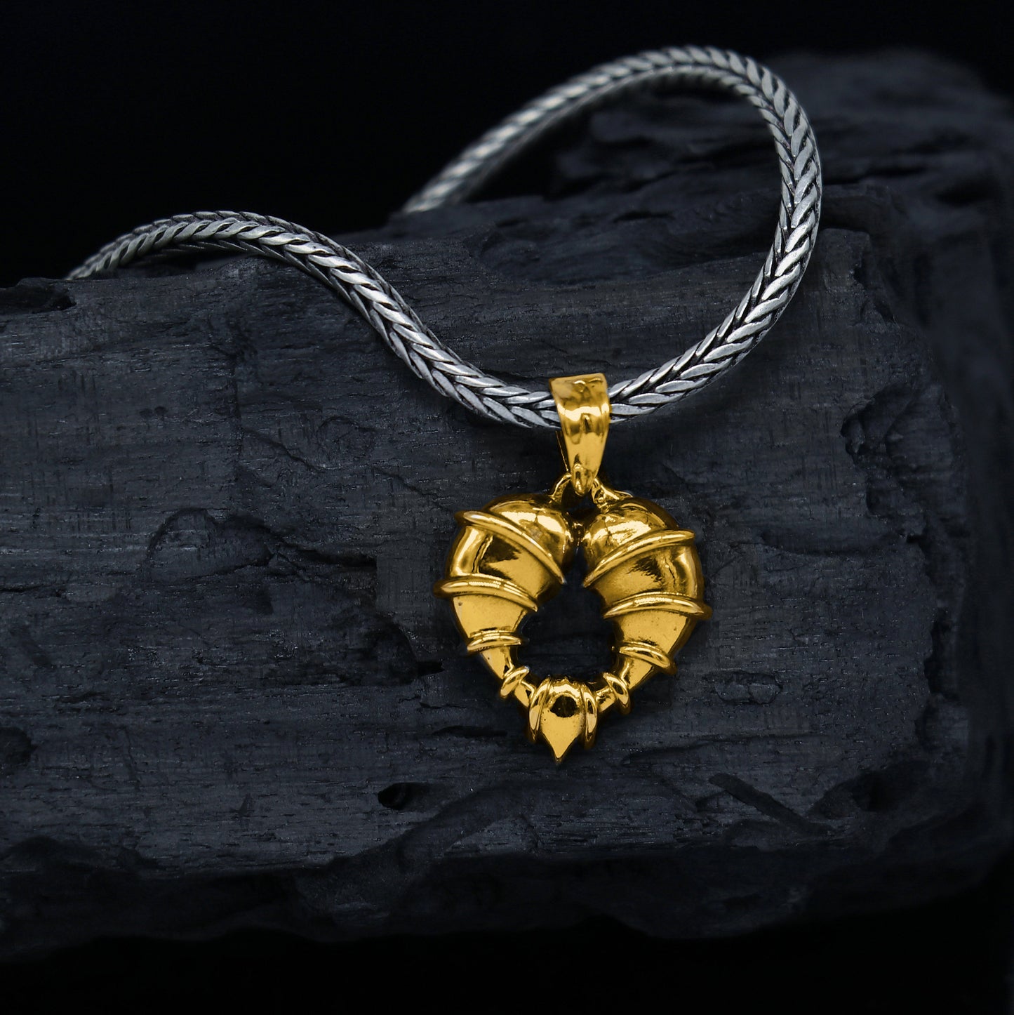 Sterling silver heart-shaped pendant necklace by TRIBAL ORNAMENTS, showcasing a unique design in 925 silver jewelry.