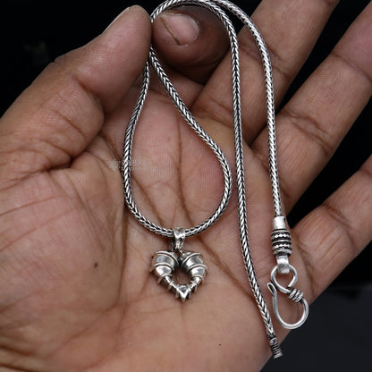 Sterling silver heart-shaped pendant necklace by Tribal Ornaments, featuring a unique design and intricate craftsmanship.