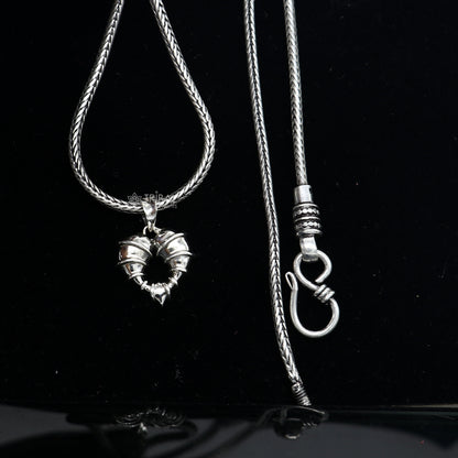 925 sterling silver heart-shaped pendant necklace by Tribal Ornaments, featuring a unique design and elegant locket style.