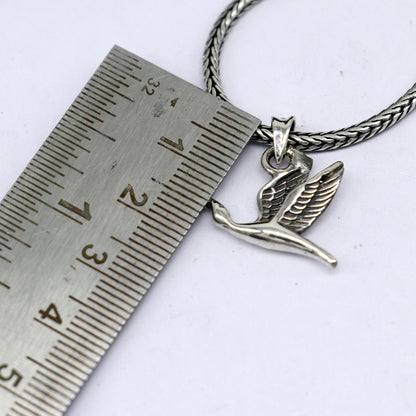 Sterling silver hummingbird pendant on a wheat chain necklace, featuring a unique design by Tribal Ornaments.
