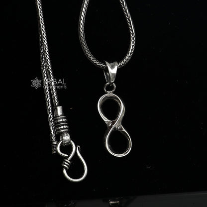 Sterling silver infinity pendant locket by TRIBAL ORNAMENTS, featuring a unique design for boys and girls.