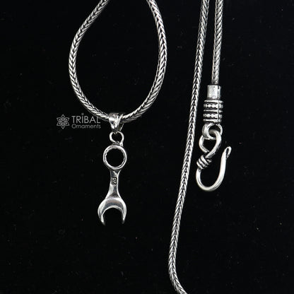 Sterling silver spanner pendant necklace with wheat chain, tribal-inspired jewelry, unique design, perfect for gifting.