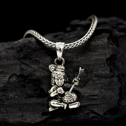 Delicate 925 sterling silver Lord Krishna Makhan Gopala pendant on a necklace, tribal-inspired jewelry featuring intricate design.