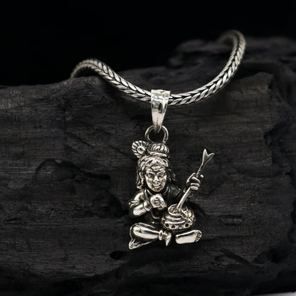 Sterling silver Lord Krishna Makhan Gopala pendant necklace, delicate tribal jewelry with intricate Krishna design.