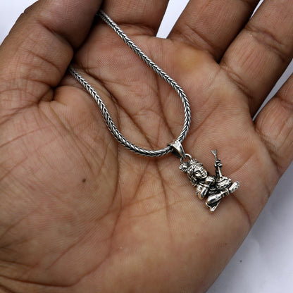 Sterling silver Lord Krishna Makhan Gopala pendant necklace, delicate tribal jewelry with intricate Krishna design.