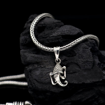 Sterling silver Lord Ganesha pendant from TRIBAL ORNAMENTS, stylish unisex jewelry with intricate handmade design, personalized accessory.