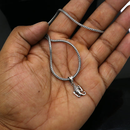 Sterling silver Lord Ganesha pendant by Tribal Ornaments, handmade unisex jewelry, featuring intricate tribal design and personalized style.