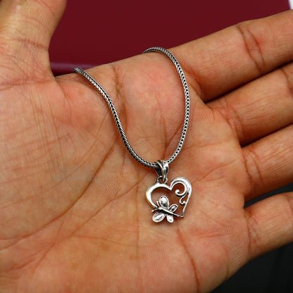 Sterling silver heart pendant by Tribal Ornaments, stylish unisex jewelry with personalized design, perfect gift accessory.
