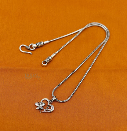Sterling silver heart pendant by TRIBAL ORNAMENTS, stylish unisex jewelry with personalized design and unique detailing.