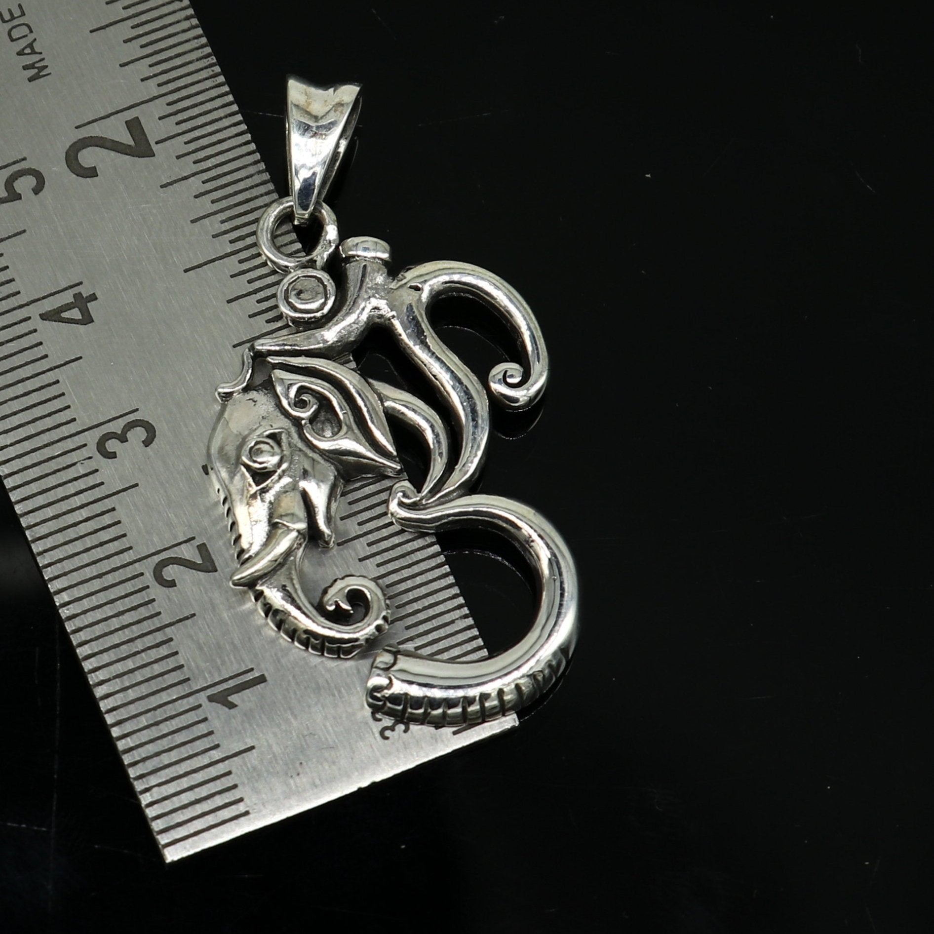 Sterling silver vintage Aum Ganesha pendant by TRIBAL ORNAMENTS, handcrafted unisex jewelry featuring intricate design and personalized style.