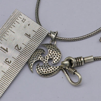 Sterling silver Ninza design Triskelion pendant by Tribal Ornaments, showcasing detailed handmade craftsmanship for boys and girls.