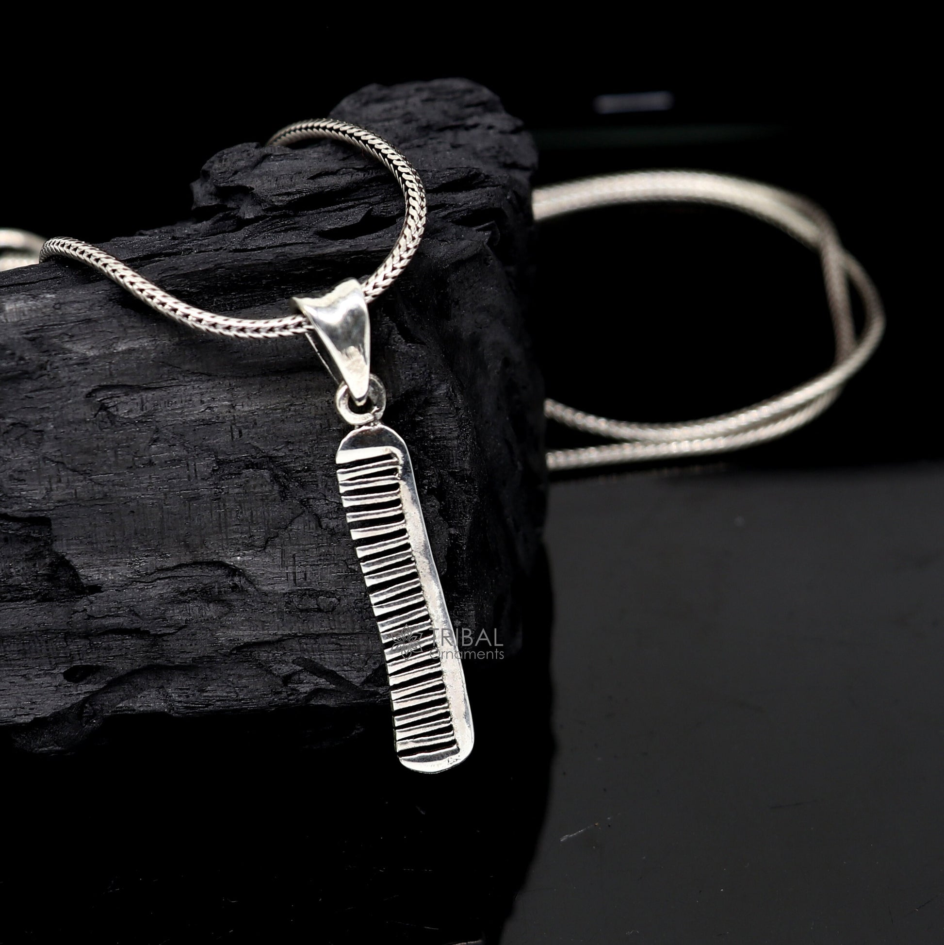 Sterling silver hair comb pendant from TRIBAL ORNAMENTS, stylish customized jewelry with intricate tribal design.