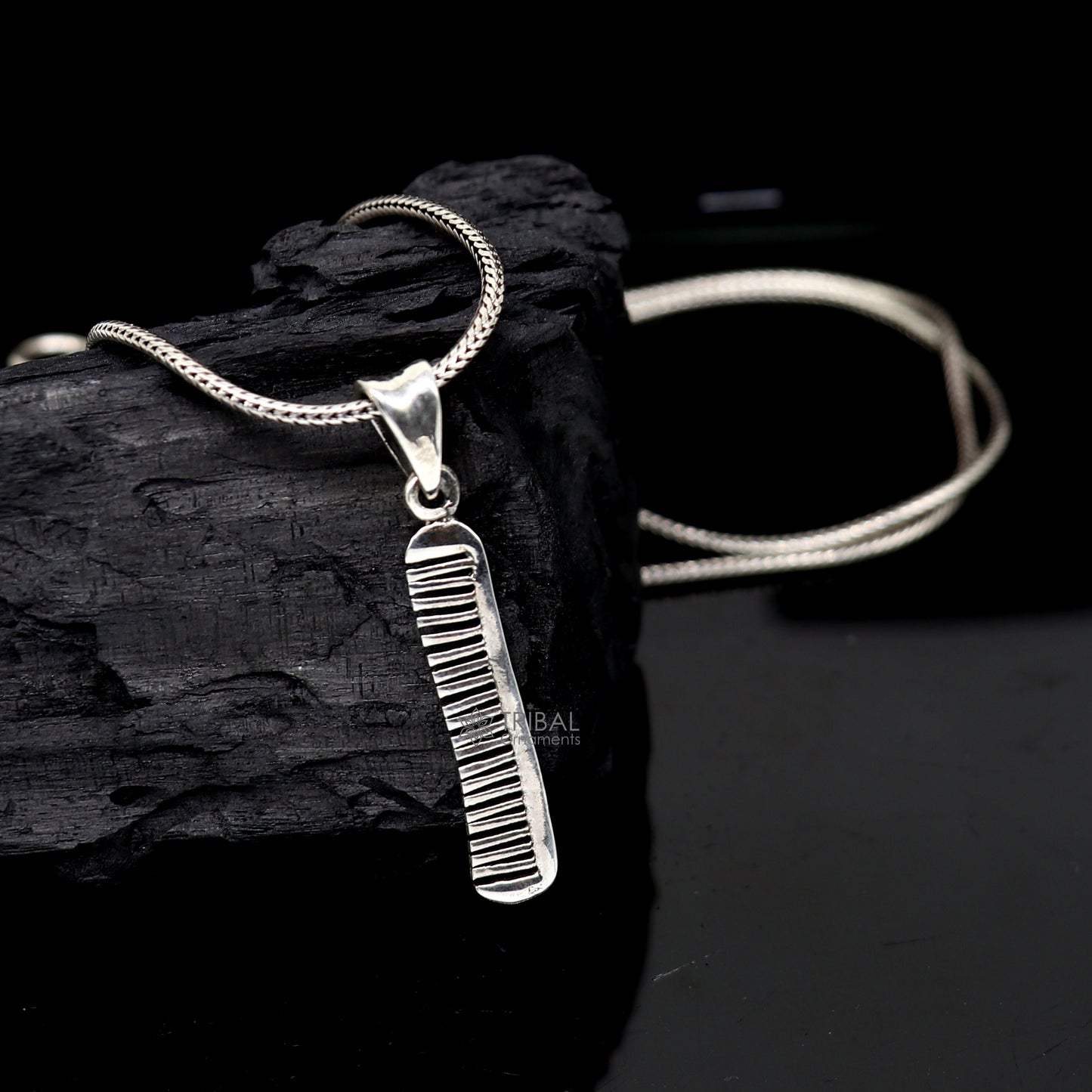 Sterling silver hair comb pendant from TRIBAL ORNAMENTS, stylish and customized jewelry with intricate tribal design.