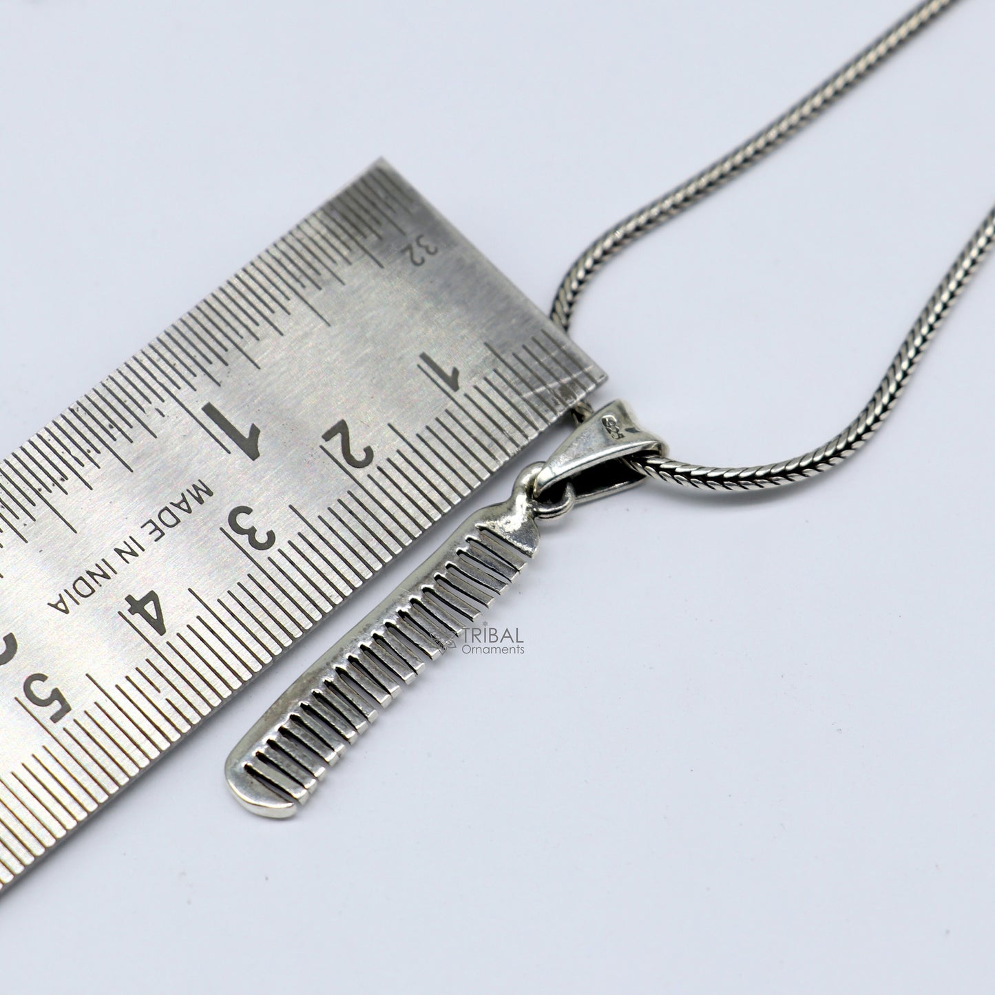 Unique hair comb pendant necklace in 925 sterling silver by TRIBAL ORNAMENTS, featuring stylish, customized Indian jewelry design.