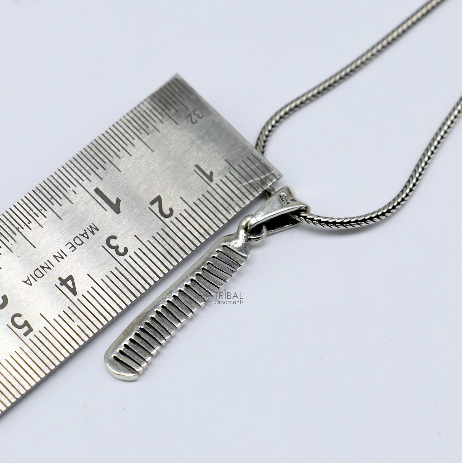 Unique hair comb pendant necklace in 925 sterling silver by TRIBAL ORNAMENTS, featuring stylish, customized Indian jewelry design.