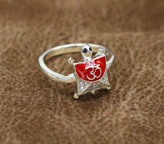 Red 925 sterling silver tortoise ring with OM blessing symbol and AD stone, elegant unisex design by Tribal Ornaments.