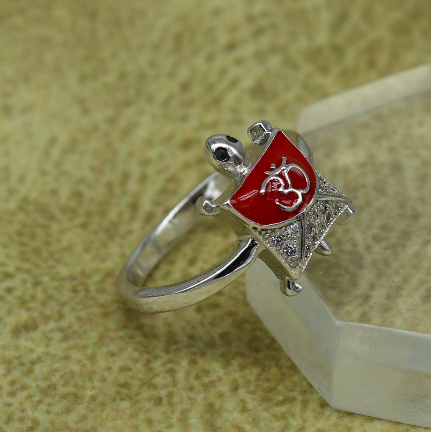 Red 925 Sterling silver tortoise ring with OM symbol and sparkling AD stone, elegant unisex design by Tribal Ornaments.