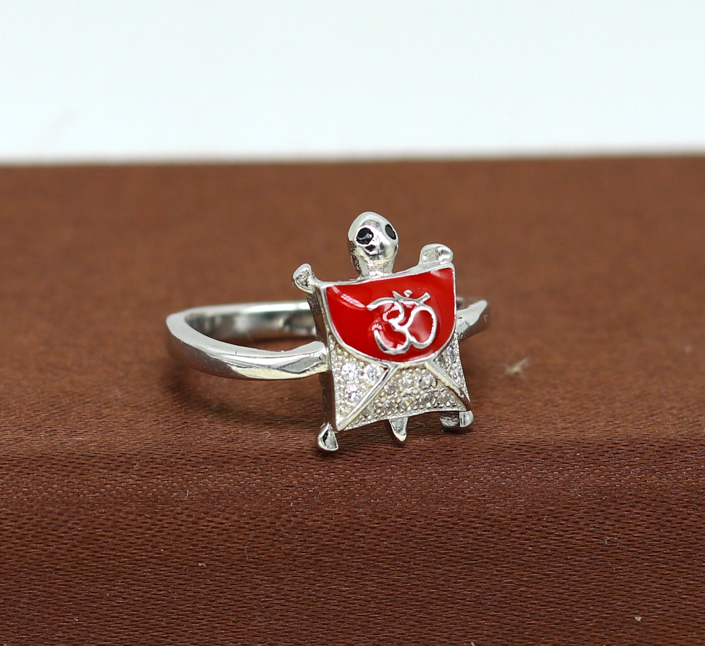 Red 925 sterling silver tortoise ring with blessing Aum OM design and AD stone, elegant unisex jewelry by Tribal Ornaments.