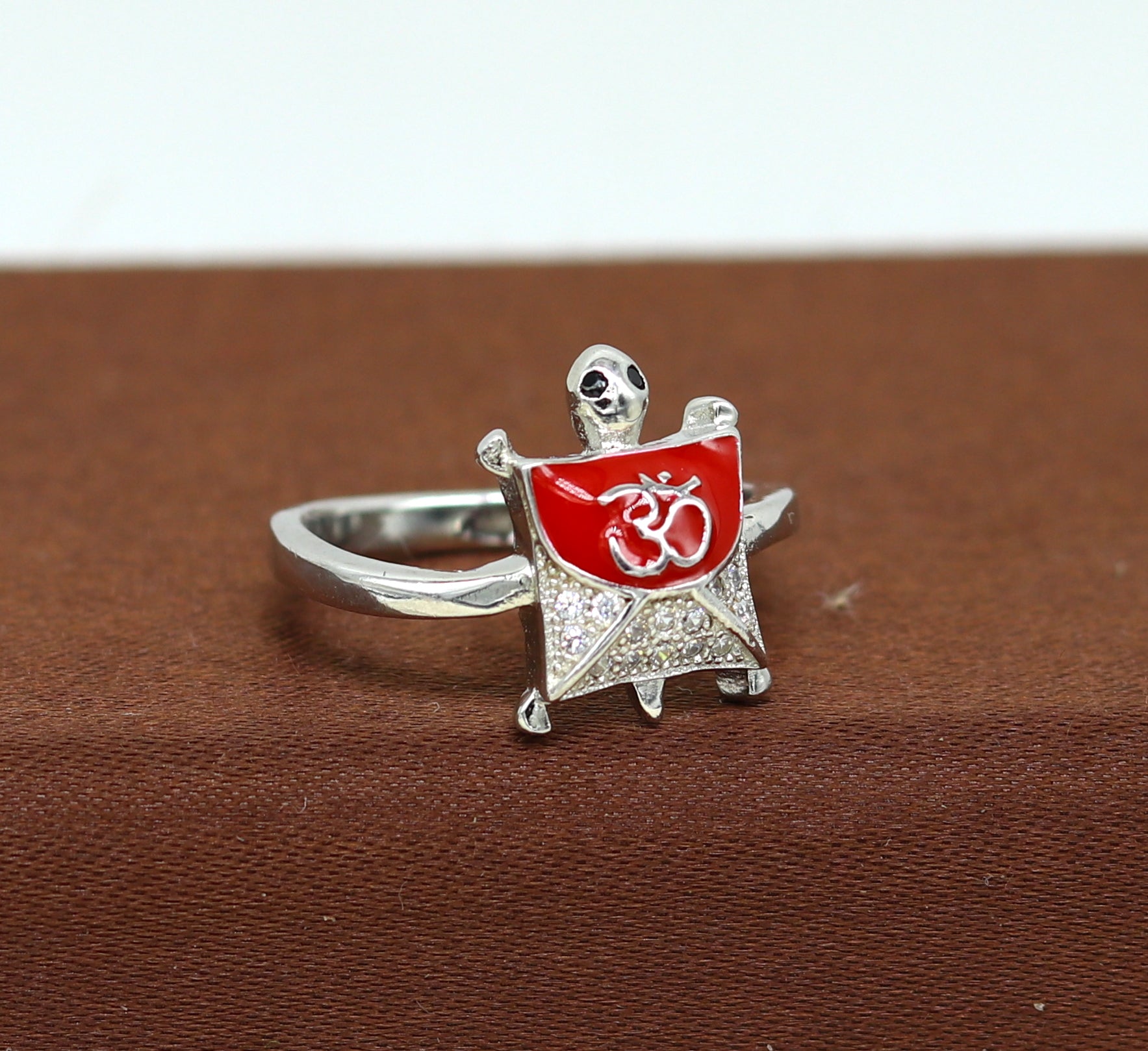 Red 925 sterling silver tortoise ring with blessing Aum OM design and AD stone, elegant unisex jewelry by Tribal Ornaments.