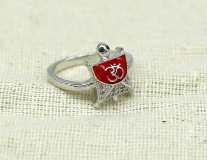 Red 925 Sterling silver tortoise ring with OM symbol, elegant unisex design, featuring a sparkling AD stone, from Tribal Ornaments.