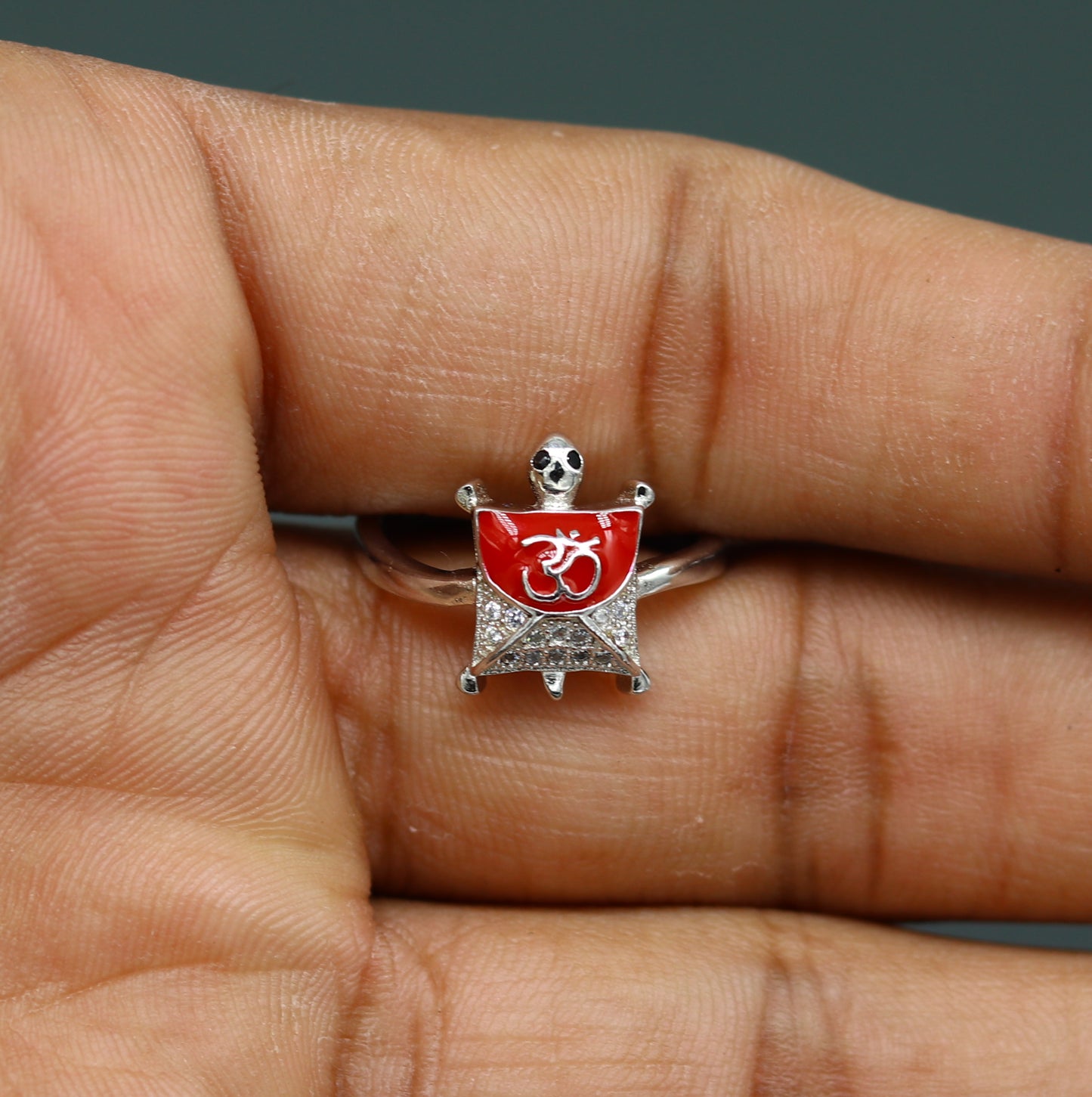 Red 925 Sterling silver tortoise ring with OM blessing design, elegant unisex jewelry featuring an AD stone from Tribal Ornaments.