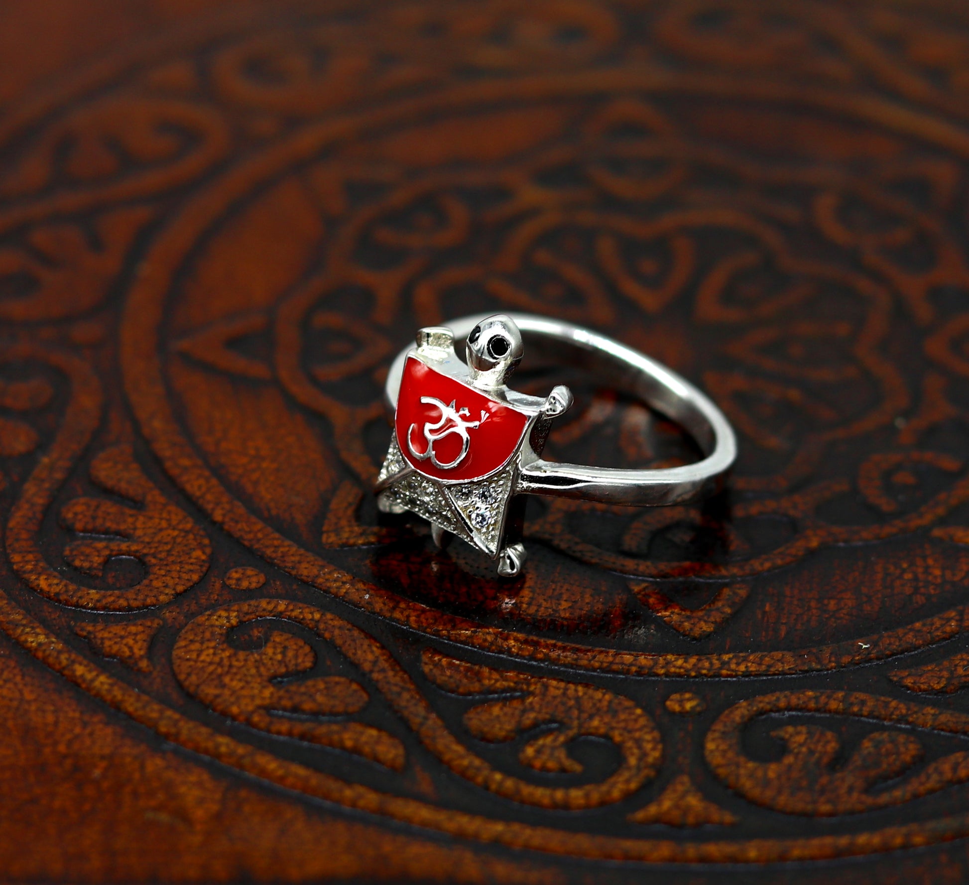Red 925 Sterling silver tortoise ring with blessing Aum or OM design, unisex elegant jewelry with AD stone from Tribal Ornaments.