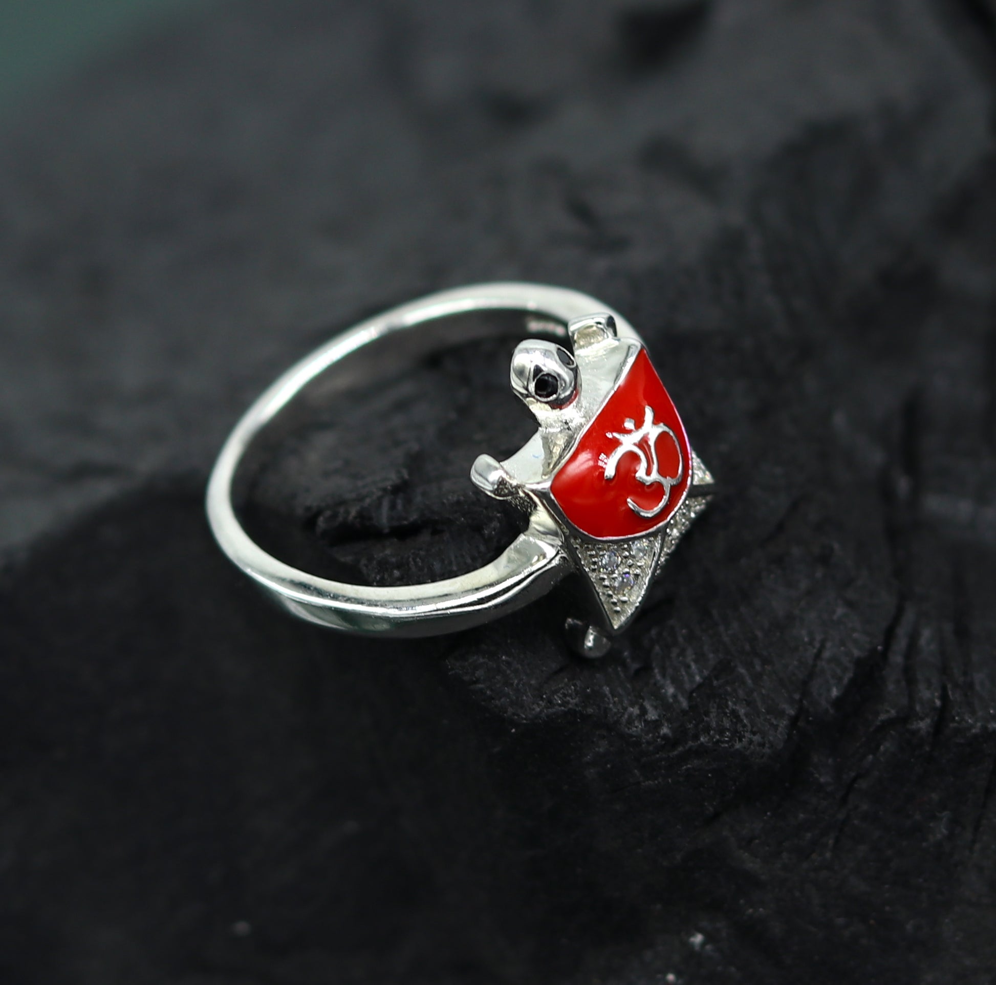 Red 925 sterling silver tortoise ring with OM symbol, featuring a sparkling AD stone, elegant unisex design, perfect for gifting.