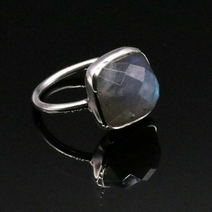 Sterling silver unisex band ring with vibrant blue fire labradorite stone from Tribal Ornaments, showcasing a bold jewelry design.