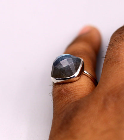 Sterling silver unisex band ring featuring a vibrant blue fire labradorite stone, crafted by Tribal Ornaments.