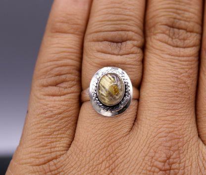 925 sterling silver jadau stone unisex ring featuring intricate tribal ornament design and elegant band.