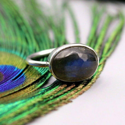 Unisex blue fire labradorite stone silver ring by TRIBAL ORNAMENTS featuring a polished labradorite gemstone set in solid silver band.