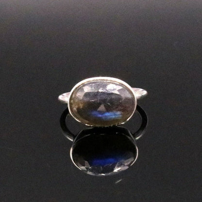 Unisex silver ring featuring a striking blue fire labradorite gemstone, crafted by Tribal Ornaments, in a sleek band design.