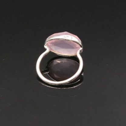 Unisex pink rose quartz silver ring with handmade 925 solid silver band by Tribal Ornaments, showcasing intricate craftsmanship.