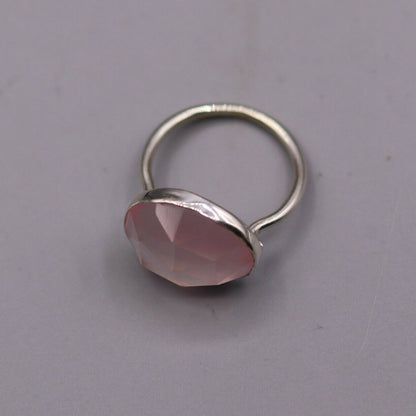 Unisex pink rose quartz ring with 925 solid silver band, handmade tribal ornament style, showcasing intricate craftsmanship.