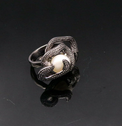 Vintage antique style 925 sterling silver pearl ring by Tribal Ornaments, showcasing a detailed band with a lustrous pearl centerpiece.