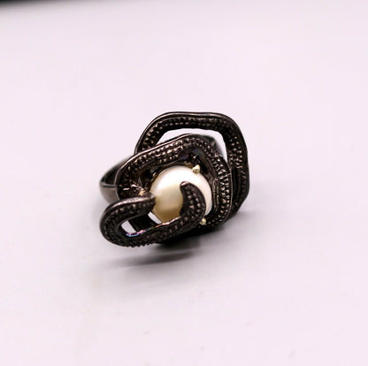 Vintage antique-style sterling silver pearl ring by Tribal Ornaments featuring a detailed band and elegant pearl centerpiece.