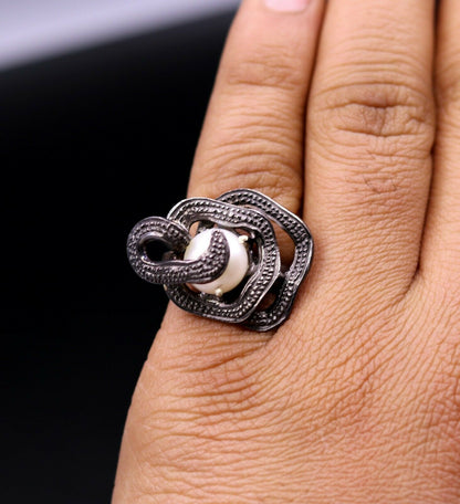 Vintage antique-style 925 sterling silver pearl ring by Tribal Ornaments, featuring a detailed band and elegant pearl accent.