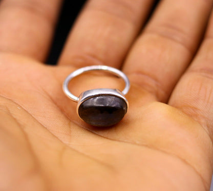 Unisex silver ring with a blue fire labradorite gemstone, featuring a polished 925 solid silver band by Tribal Ornaments.