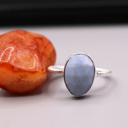 Handmade silver ring with a vibrant stone, crafted by Tribal Ornaments, perfect for unisex anniversary gifting.